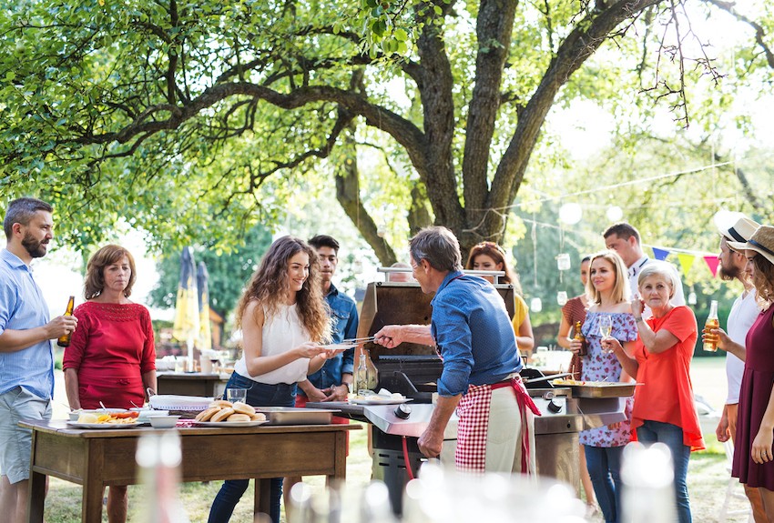 People wait for food at a family barbeque 